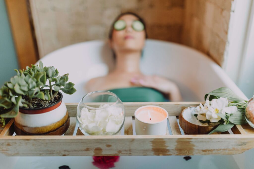 Relaxing items in front of a person in a tub