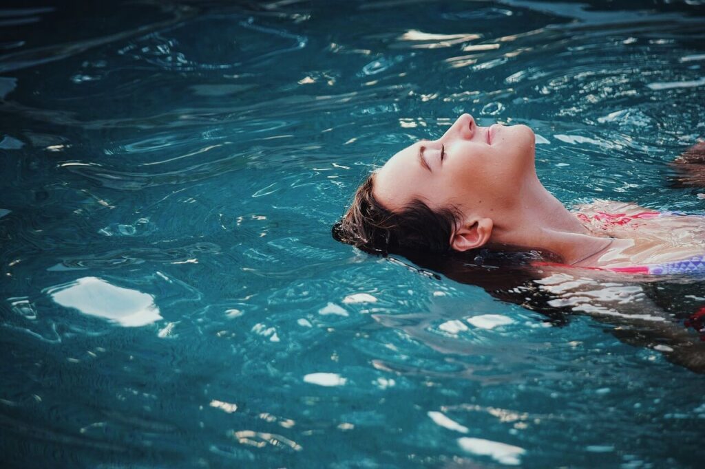 A woman using a swim spa