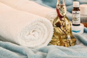 Various towels and massage oils that you'll find spas have